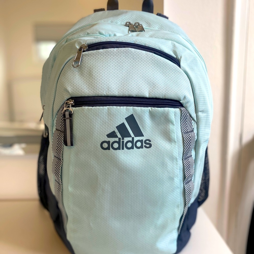 Light blue ADIDAS backpack with lunch bag.